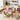 12 Days of Christmas candy bar set with twelve numbered illustrated chocolate bars and gift box on a holiday gift wrapping table