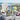 A Day at the Beach gift tote in woven rope with a yellow towel embroidered with a name, a magazine, water and snacks, on an Adirondack chair on a beach house deck with sunglasses and a beach ball