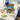 Back to school snack box with a royal blue bow, packed with Welch's fruit snacks, Smartfood popcorn, Frosted Flakes, Crayola crayons and school supplies, on a kitchen island with a composition notebook, smiley stress ball and a kids backpack