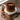 Chocolate Pretzel Cake with chocolate frosting and a crown of pretzels on a white cake stand