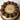Close view of Reese's cups and chocolate rosettes on peanut butter frosting