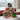 Personalized Christmas candy pyramid of six clear cubes with name lettering and holiday decals on a snowy window seat