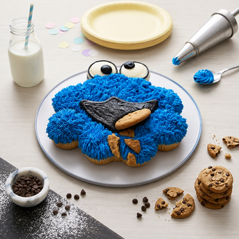 Cookie Monster Cupcake Cake, a pull-apart cupcake arrangement in blue buttercream fur with candy eyes and a cookie