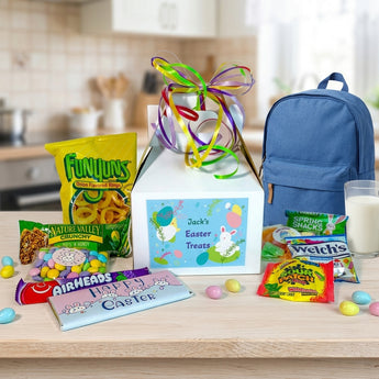 Easter Personalized Gable Box, a white gable box with a personalized Easter label, Funyuns, Welch's fruit snacks and Airheads, on a kitchen counter