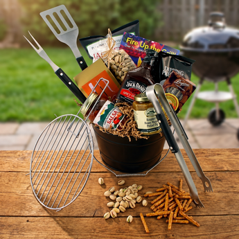 Fire Up the Grill gift bucket with grilling tools on a backyard table | Boston Gift Baskets