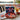 Hand Decorated 4th of July Sugar Cookies, USA, flag and star sugar cookies on a red plate with a blue gift box, on a lake house porch table