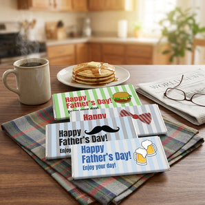 Happy Father's Day Hershey Bars, eight Hershey bars in striped Happy Father's Day wrappers, on a breakfast table with coffee and a newspaper