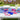 July 4th Hershey's Chocolate Bars, eight Hershey bars in red, white and blue Fourth of July wrappers with a personalized message bar, on a picnic table at a backyard cookout