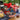 July 4th Snack Basket, an American flag basket of Jelly Belly, Walkers shortbread and snacks with a red bow, on a patio table at a Fourth of July party