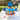 Multi stripe graduation cake with red, yellow, white and blue buttercream stripes and a blue piped top, styled on a backyard party table with a graduation cap and confetti