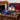 New York Giants Gift, a Giants cap with chocolate footballs, Big Apple Beans, Coca-Cola, mixed nuts and coffee, on a side table by the sofa
