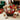 Nutcracker Sweet holiday gift basket in a dark willow basket with cheese sticks, honey and jelly beans beside a fireplace