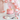 Pink Sprinkles Cake with strawberry buttercream and sprinkles at a party