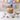 Rainbow Sprinkles Candy Cake covered in sprinkles and topped with lollipops and candies
