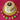 Another view of the Spring Bird's Nest Cake in white fondant with yellow panels, topped with a chocolate nest of colorful candy eggs