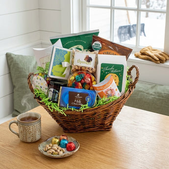 Thanks A Bunch gift basket with cookies, chocolate and tea on a breakfast nook table on a snowy morning
