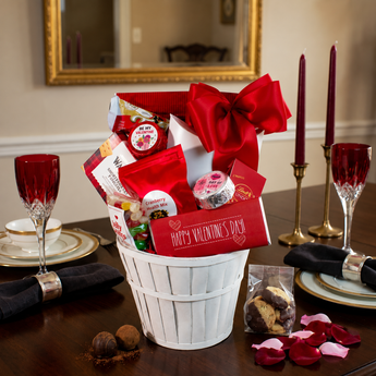 Valentine Pleaser Valentine's Day Gift Basket on a romantic dinner table | Boston Gift Baskets