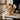 Wish Upon a Star gift basket in a gold wire star basket with gold foil chocolates on a marble and brass bar cart