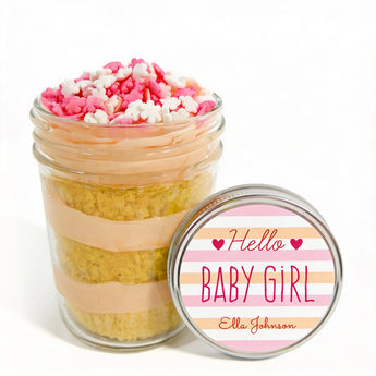 Jar of layered cupcake dessert with customizable 'Hello Baby Girl' label on a white background