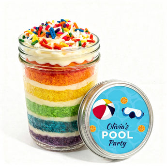 Colorful layered cupcake in a jar with a pool party-themed lid on a white background