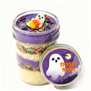 Halloween-themed cupcake dessert in a jar with colorful sprinkles and a customizable ghost label on a white background