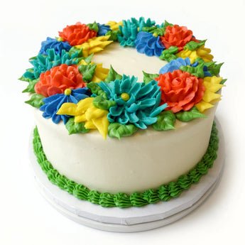 Colorful flower-shaped cake on a white background