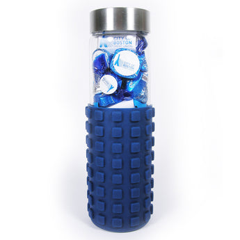 Glass water bottle with a navy sleeve filled with blue foil Hershey's Kisses carrying sample logo labels