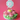 Blooming Flower Cupcake Cake with pink buttercream roses, green leaves and a Happy Birthday topper on a pink background