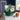 Upturned green basketball cap filled with snacks and chocolate basketballs on a teen bedroom desk