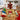 Christmas cookie decorating kit with sugar cookies, icing bags and sprinkles laid out on a butcher block kitchen counter