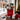City Sidewalks red Boston holiday gift tote with local treats, a Boston walking guide, city map and cookies on a Beacon Hill cafe table