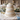 Classic Rose Wedding Cake, three tiers in white fondant with handcrafted white roses at a reception table