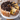 Sliced Cookies & Cream Cake showing chocolate cookie pieces in the vanilla crumb