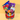 Crayon Candy Vase, a vase wrapped in Crayola crayons with a red ribbon, filled with Tootsie Pops, a rainbow swirl lollipop, jelly beans and chewy candy on a yellow backdrop