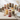 Twelve assorted layered cupcake jars in mixed flavors arranged on a wooden party table