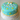 Custom Baby Name Cake with fondant baby booties and hand-lettered name, alternate view