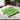 Merry Christmas personalized candy bars in green holiday lights wrappers on a marble counter