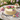 Pastel Petals Cake with hand-piped pastel buttercream roses on a garden table