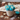 Snowflake cupcake bouquet with blue and white frosted cupcakes and sugar snowflakes in a basket