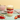 Strawberry cupcake jar layered with strawberry cake and vanilla buttercream with fresh strawberries alongside