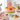 Sugar Garden Cake decorated with an assortment of hand-piped buttercream flowers in soft colors