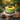 Sunflower Cake in green buttercream topped with a fondant sunflower and bees, on a garden table