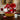 Valentine Pleaser Valentine's Day Gift Basket Large size: a wide woven wood basket tied with a big red satin bow, filled with Valentine's treats including a red Loacker box, Turtles Bites, a Happy Valentine's Day box, sweetheart cookies and Cranberry Health Mix, styled on a dark wood dining table with red crystal glasses and burgundy taper candles