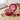 Valentine's Day Candy Tin, a red tin of Hershey's chocolates and Valentine candy with a Day of Love lid, on an office desk with a red rose