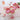 Valentine's Day Iced Sugar Cookies, pink, red and white decorated heart cookies on a scalloped plate with roses and sparkling drinks