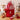 Valentine's Day Personalized Baking Kit, a red tote embroidered with an initial holding a heart spatula, oven mitt, baking mix and treats, on a butcher block kitchen counter