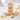Vanilla sprinkles cupcake jar with layers of vanilla cake, buttercream and rainbow sprinkles on a party table