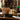 VIP Sparkling gift box with sparkling cider, truffles, shortbread, crackers and pretzels on a leather desk in a home library
