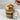 Layered cupcake dessert in a jar with a customizable 'Happy Thanksgiving!' label, being scooped with a spoon.