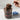 Double chocolate layered cupcake dessert with sprinkles in a jar being lifted out with a spoon with customizable graduation-themed lid design. 